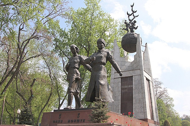 Kazakh Parliament members lay flowers at Aliya Moldagulova and Manshuk Mametova monuments